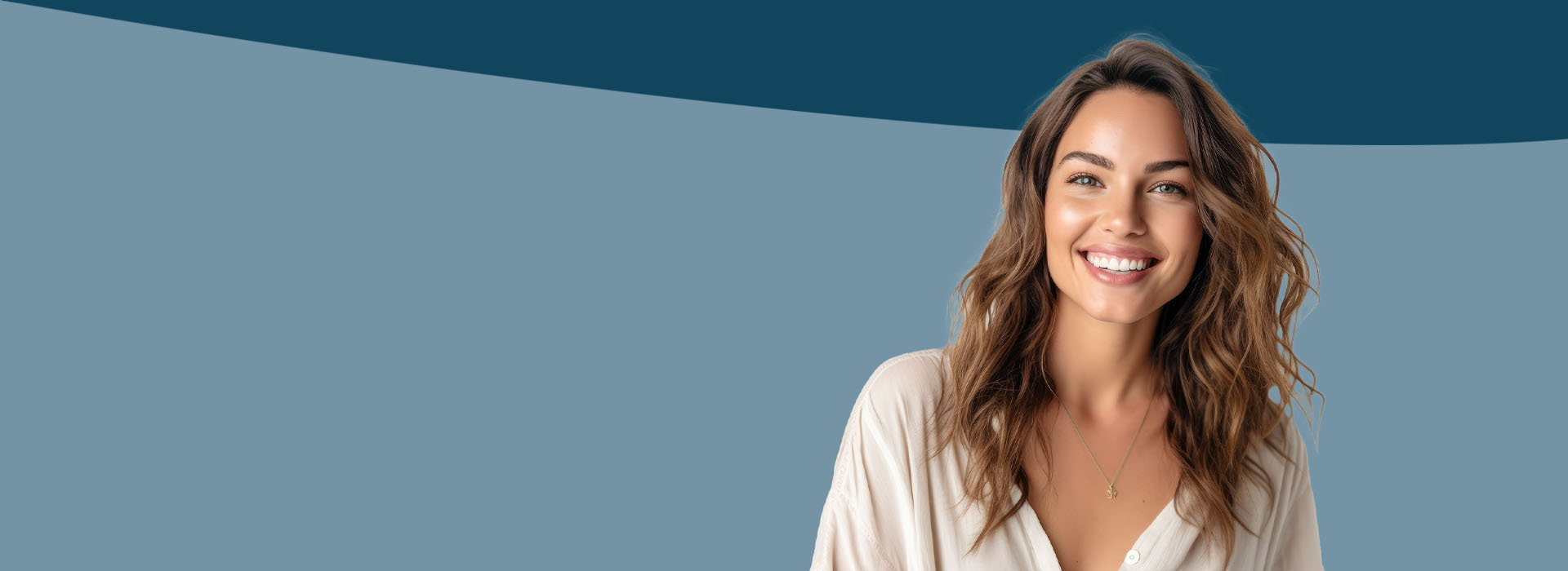 The image shows a woman with short hair smiling at the camera, wearing a light-colored top against a plain background.