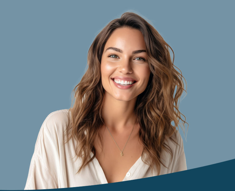 A woman with long hair, smiling at the camera.