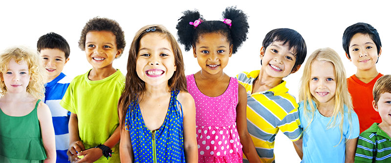 Children of various ages and ethnicities, posing for a group photo with smiles.